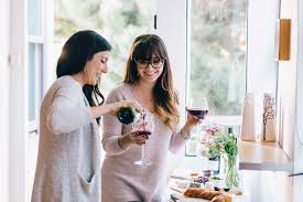 wine magic two ladies sharing a glass of wine